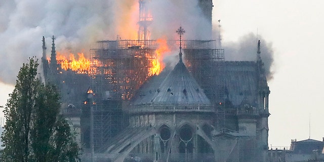 Flames rise during a fire at the landmark Notre-Dame Cathedral in central Paris on April 15, 2019 afternoon. (Photo by FRANCOIS GUILLOT / AFP)