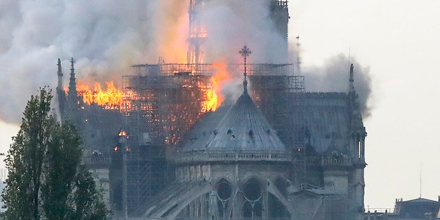 Flames rise during a fire at the landmark Notre-Dame Cathedral in central Paris on April 15, 2019 afternoon. (Photo by FRANCOIS GUILLOT / AFP)