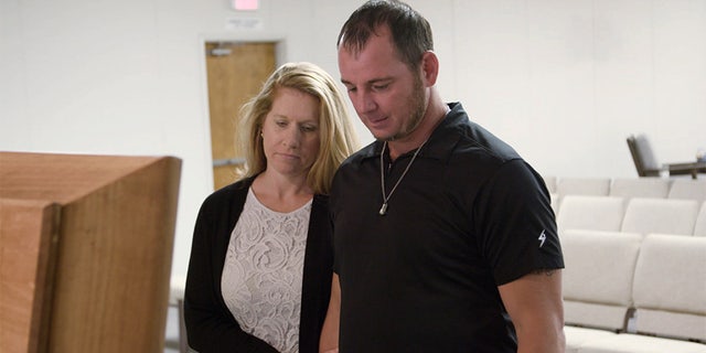 Jason Freeman with his wife at Charles Manson's funeral. — Reelz