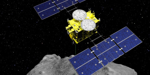 In this computer graphics image published by the Japan Aerospace Exploration Agency (JAXA), the spacecraft Hayabusa2 is seen above the asteroid Ryugu.