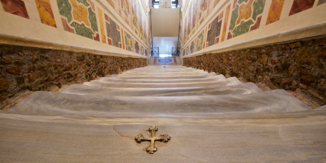 A view of the newly restored Holy Stairs (Scala Sancta), which according to Catholic Church is the stair on which Jesus Christ stepped leading on his way to the crucifixion, during a special opening, in Rome, Thursday, April 11, 2019. (AP Photo/Andrew Medichini)