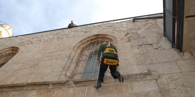 Abseiling the walls of the Last Supper room.