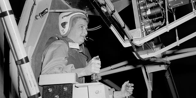 In this 1960 NASA photo, Jerrie Cobb prepares to operate the multi-axis space test (MASTIF) inertia at Lewis Research Center in Ohio. (NASA via AP)