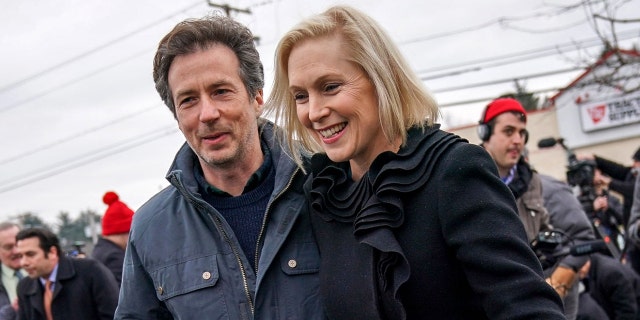 Sen. Kirsten Gillibrand and her husband Jonathan Gillibrand walk together after a media availability announcing she will run for president in 2020 outside the Country View Diner, January 16, 2019 in Troy, New York. (Photo by Drew Angerer/Getty Images)