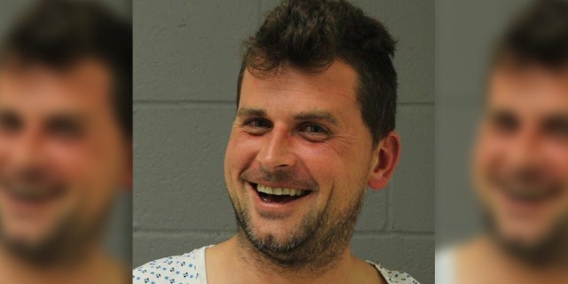 Joseph Achenbach was arrested after police said he crashed his SUV into a family's yard and then wandered in their home.