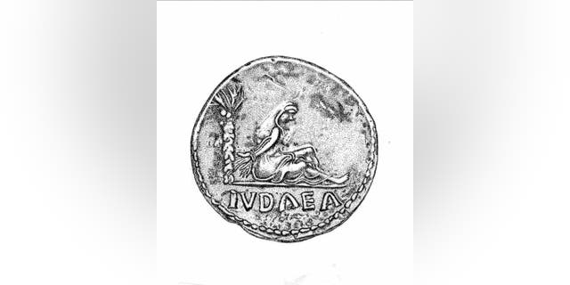 File image - a Roman coin showing Judaea personified as a captive, with her hands tied behind her back. It was issued to celebrate the crushing of Simon Bar Kochba's revolt of 132-5. This coin was not excavated from the Beersheba site.