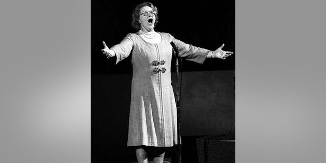 Kate Smith sings "God Bless America" prior to a Philadelphia Flyers Stanley Cup playoff game in May 1975. (AP Photo, File)