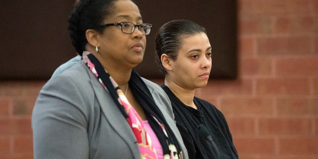 Katiria Tirado, 33, right, the Hartford mother charged in the death of her 17-year-old autistic son, Matthew Tirado, appears in Hartford Superior Court on Tuesday, March 21, 2017.
