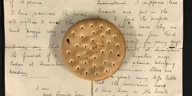 The hardtack ship's biscuit and the letter describing its discovery. (Henry Aldridge and Son)