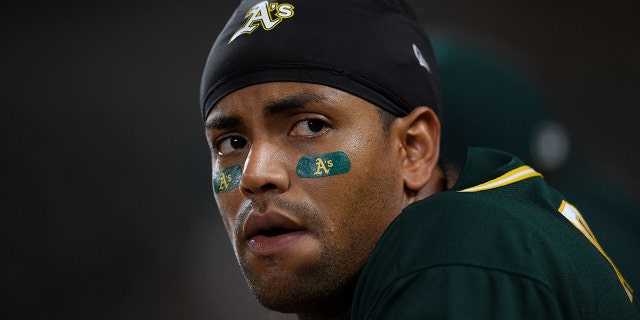 Oakland Athletics' Khris Davis watches from the dugout during the eighth inning of a baseball game against the Baltimore Orioles, Monday, April 8, 2019, in Baltimore.