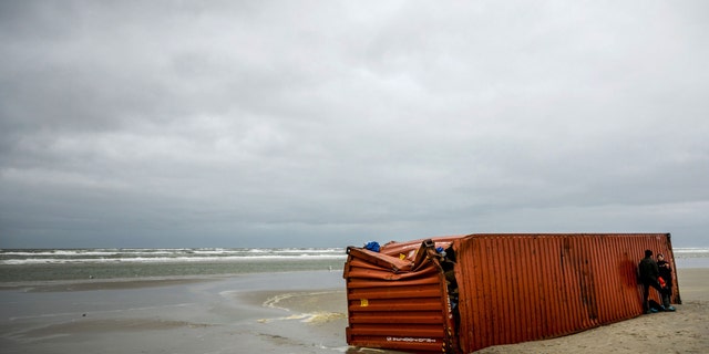 Volunteers clean up the coastline after goods from shipping containers of the vessel MSC Zoe washed up on the shores of Schiermonnikoog island, on Jan. 4, 2019. The MSC Zoe, which was mostly carrying toys, furniture and auto parts, lost the containers late on January 1, 2019, while battling a storm off the Frisian Islands, an archipelago off the northwestern Dutch coast also known as the Wadden Islands.