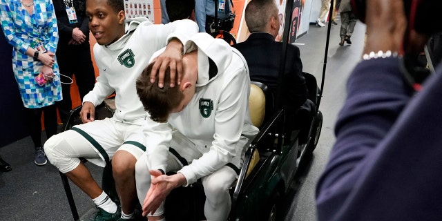 Michigan State's Cassius Winston, left, and Matt McQuaid react after the team's 61-51 loss to Texas Tech. (AP Photo/David J. Phillip)