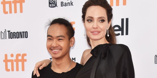 Angelina Jolie and her son Maddox Jolie-Pitt (L).