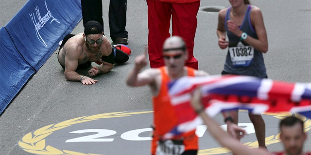 Micah Herndon, a Marine who served in Iraq and Afghanistan, crawled across the finish line of the Boston Maraton on Monday.
