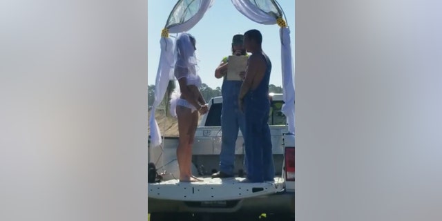After exchanging their vows, Jeremy then carried Ahrielle down to a mud hole and dropped her in before soon joining her for a kiss.