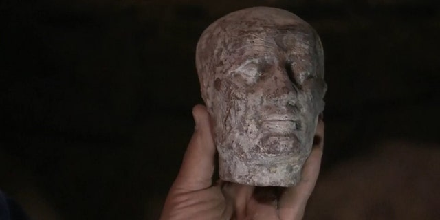Archaeologists also discovered a 2,500-year-old wax head, which is thought to be a cast of High Priest “Irt Hrw." (Discovery Channel)