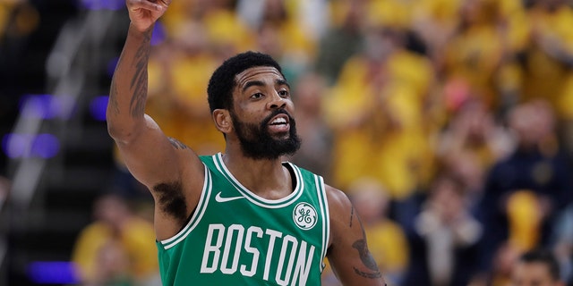 Boston Celtics guard Kyrie Irving gestures during the first half of Game 3 of the team's first-round playoff series against the Indiana Pacers April 19, 2019, in Indianapolis.