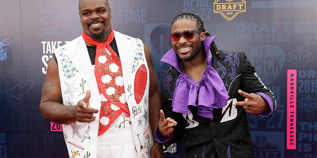Vince Wilfork, left and DeAngelo Willimas walk the red carpet ahead of the first round at the NFL football draft, Thursday in Nashville, Tenn. (AP Photo/Mark Humphrey)