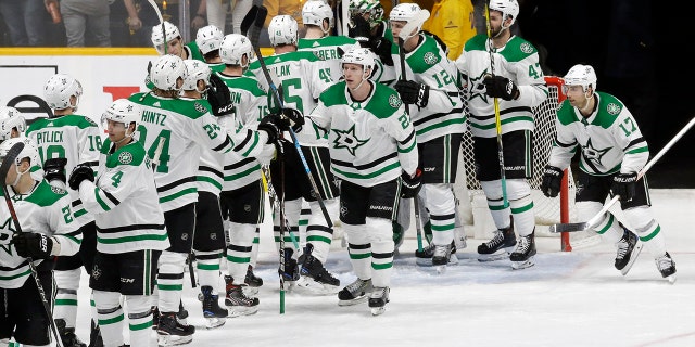 The Dallas Stars celebrate after defeating the Nashville Predators 3-2 in Game 1 of an NHL hockey first-round playoff series Thursday, April 11, 2019, in Nashville, Tenn. (AP Photo/Mark Humphrey)