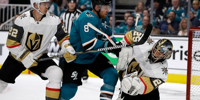 San Jose Sharks' Joe Pavelski (8) reacts after scoring a goal against Vegas Golden Knights goalie Marc-Andre Fleury, right, during the first period of Game 1 of an NHL hockey first-round playoff series Wednesday, April 10, 2019, in San Jose, Calif. At left is Golden Knights defenseman Nick Holden.