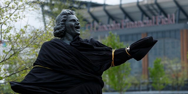 A partially covered statue of singer Kate Smith is seen near the Wells Fargo Center, Friday, April 19, 2019, in Philadelphia. (AP Photo/Matt Slocum)