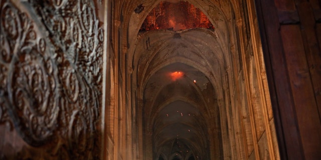 Flames and smoke are seen as the interior continued to burn inside the Notre Dame Cathedral in Paris, France, April 16, 2019.