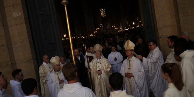 The archbishop of Paris and Catholics from around France and the world honored the firefighters who saved Notre Dame Cathedral, praying Sunday at a special Easter Mass for a swift reconstruction of the beloved monument.