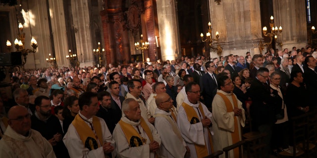 Faithfuls attend a Sunday Mass at the grandiose Saint-Eustache church on the Right Bank of the Seine river in Paris, Sunday, April 21, 2019.