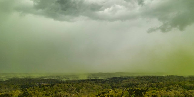 The clouds of pollen could be seen before thunderstorms moved into the region on Monday.