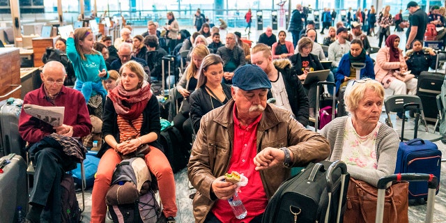 Travellers wait during a strike of Scandinavian Airlines' (SAS) pilots on April 26, 2019 at the Gardamoen Airport in Oslo, Norway.