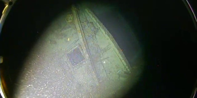 Debris can be seen on the SS Iron Crown's bow near the ship's open cargo hold.