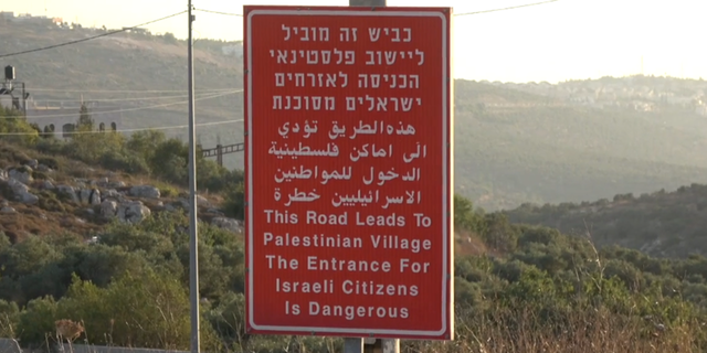 Sign outside the Arab village of Yasuf