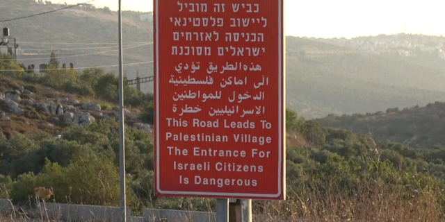 Sign outside the Arab village of Yasuf