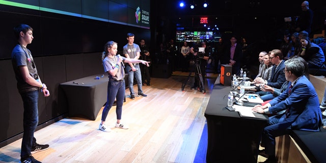 Students Jonah Hoffman, Paige Tayloe and Trey Fisher of Owensville High School in Owensville, Missouri present their STEM project to judges at the Samsung Solve for Tomorrow National Finalist Pitch Event on Monday, April 1, 2019 in New York City (Samsung)