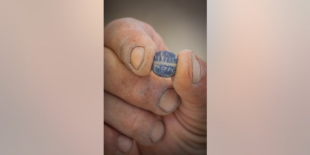 The Ikar Ben Matanyahu seal found in the City of David. (Photo Credit: Eliyahu Yanai, City of David) 