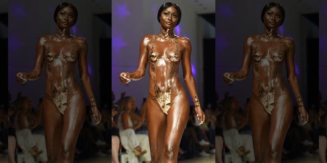 A model walks the runway for Black Tape Project at Miami Swim Week in 2018.