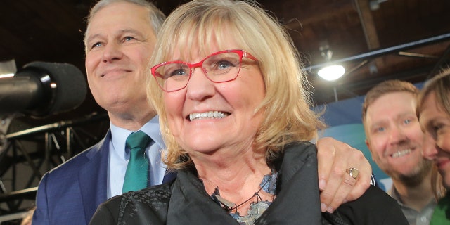 Washington Gov. Jay Inslee (left) and his wife Trudi Inslee as he announces his run for the 2020 Presidency at A & R Solar on March 1, 2019 in Seattle, Washington. (Photo by Karen Ducey/Getty Images)