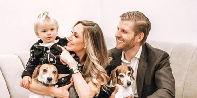 Lara and Eric Trump with their 1-year-old son Luke and their two dogs Charlie and Ben.