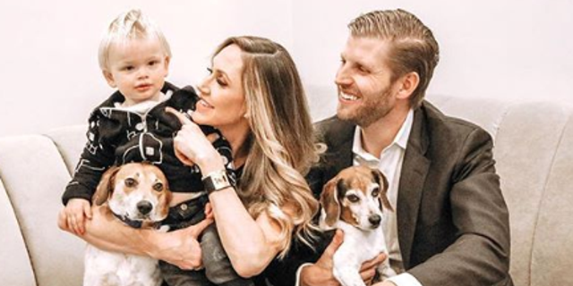 Lara and Eric Trump with their 1-year-old son Luke and their two dogs Charlie and Ben.