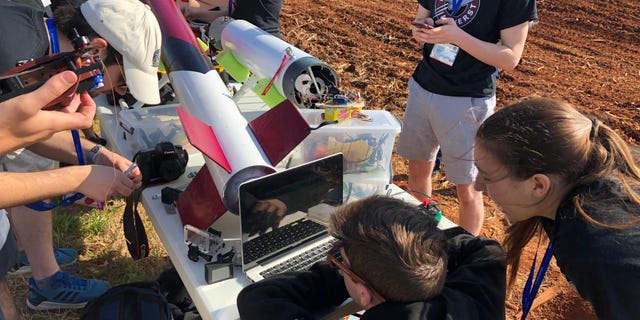 UMass Rocket Team feverishly works to troubleshoot overheating issues with its payload system ahead of its rocket launch. (Fox News/Charles Watson)
