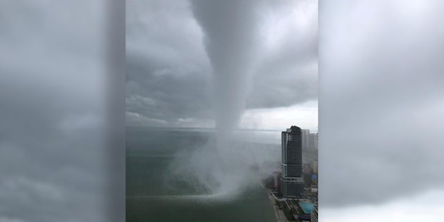 Massive waterspout in Malaysia spins off shore before making landfall ...