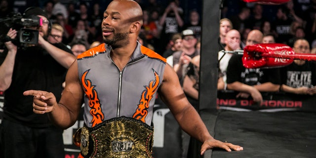 Jay Lethal poses at ringside with the ROH World Championship