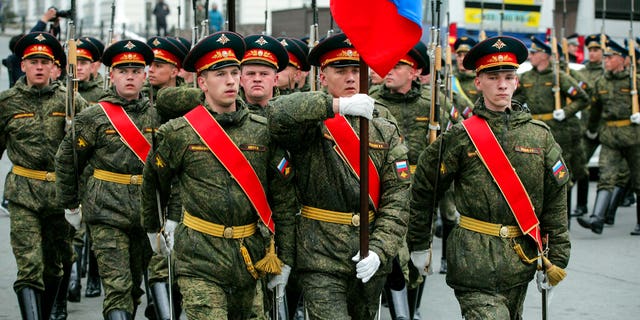 Russian honor guards leave an official welcoming ceremony for North Korean leader Kim Jong Un at the railway station in Vladivostok, Russia, Wednesday, April 24, 2019.