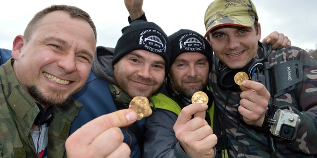 Dariusz Fijalkowski , Mateusz Nowak, Andrew Winter, Tobiasz Nowak. Four amateur metal detectorists have uncovered a hoard of 14th-century coins in a field in Hambleden, Buckinghamshire- worth an estimated £150,000. (Credit: SWNS)