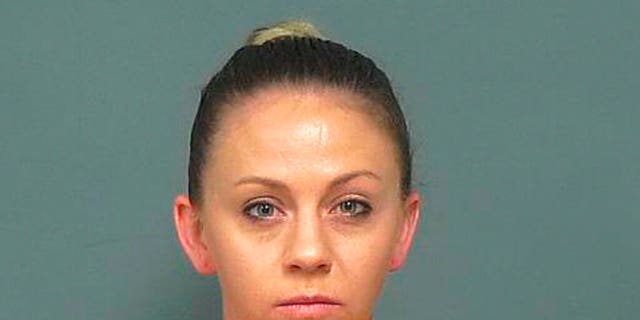 <br>
​​​​​​Amber Guyger is seen in a photo taken Friday, Nov. 30, 2018. (Mesquite Police Department via Associated Press)