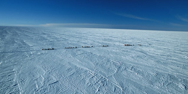 Researchers on their way to Dome C near the Concordia station on the Antarctic Plateau in Antarctica.