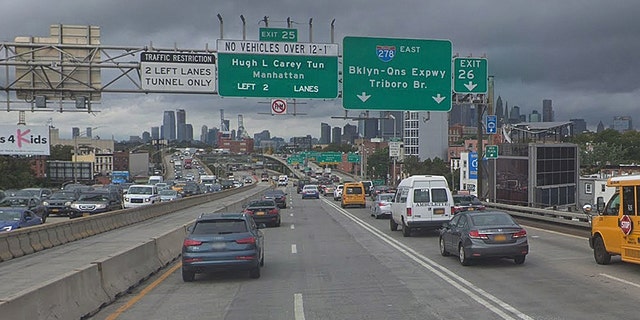 Cars traveling on the Brooklyn Queens Expressway. A cat was rescued hanging off the edge of the highway, thanks to a joint effort between Brooklyn students and the NYPD