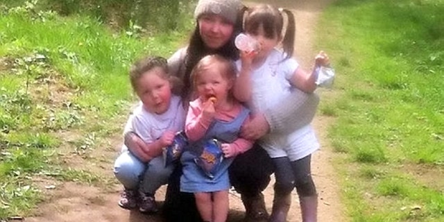 Cleo, pictured center with her mom and siblings, is currently receiving chemotherapy to shrink the tumor before she undergoes surgery to remove it.