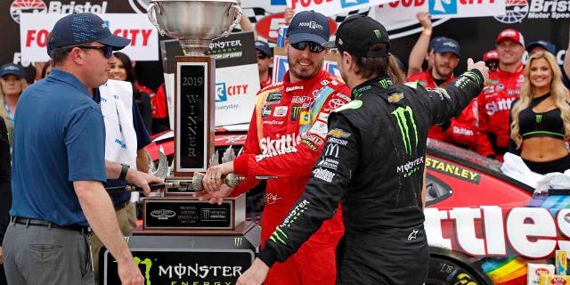 Kurt (in black suit) said he would've wrecked Kyle (in red suit) to get the win if he had the chance.