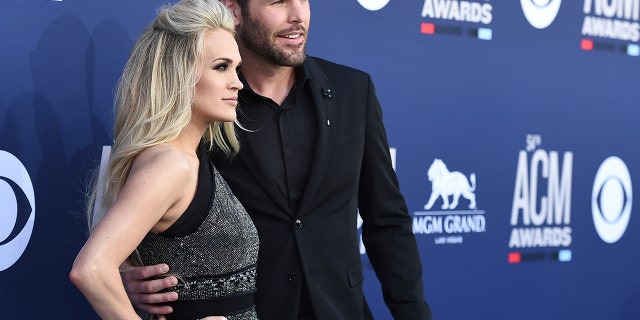 Carrie Underwood and Mike Fisher arrive at the 54th annual Academy of Country Music Awards at the MGM Grand Garden Arena on Sunday, April 7, 2019, in Las Vegas.
